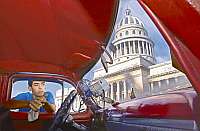 A viso do Capitlio, em Havana, surge, imponente, pelo vidro do antigo carro do taxista
