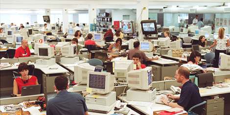 Journalists work at Folha de S.Paulo's Newsroom in the evening